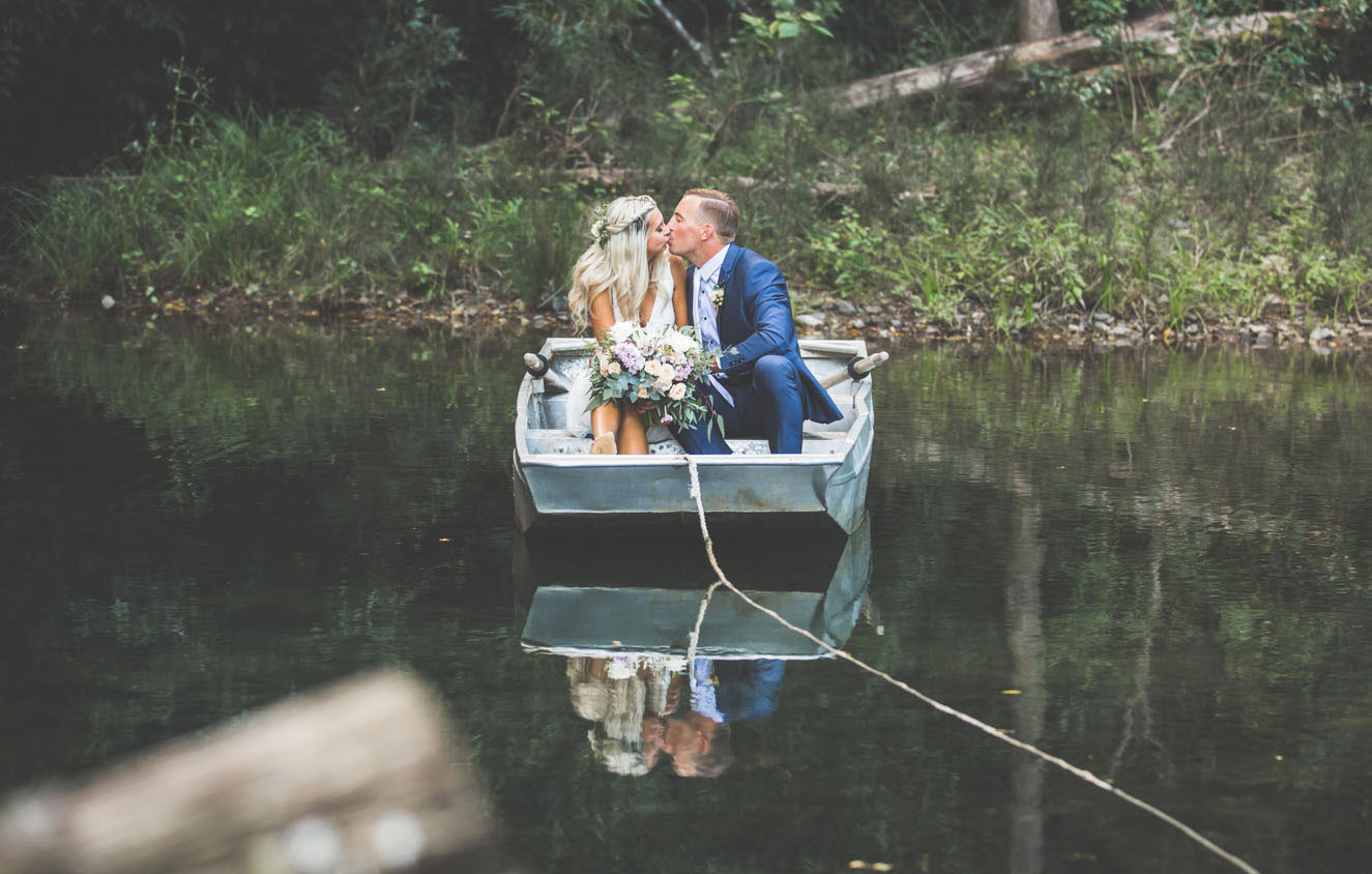 romantic bridal couple kiss in boat video gallery photograph