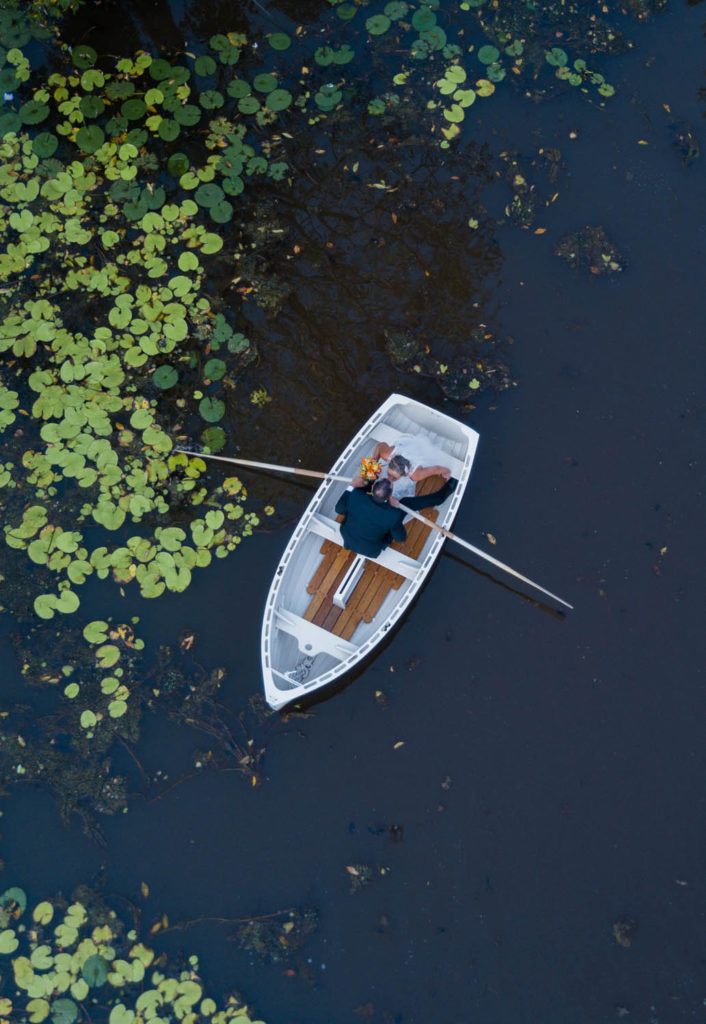 aerial drone photography of boat at secrets on the lake maleny lake baroon