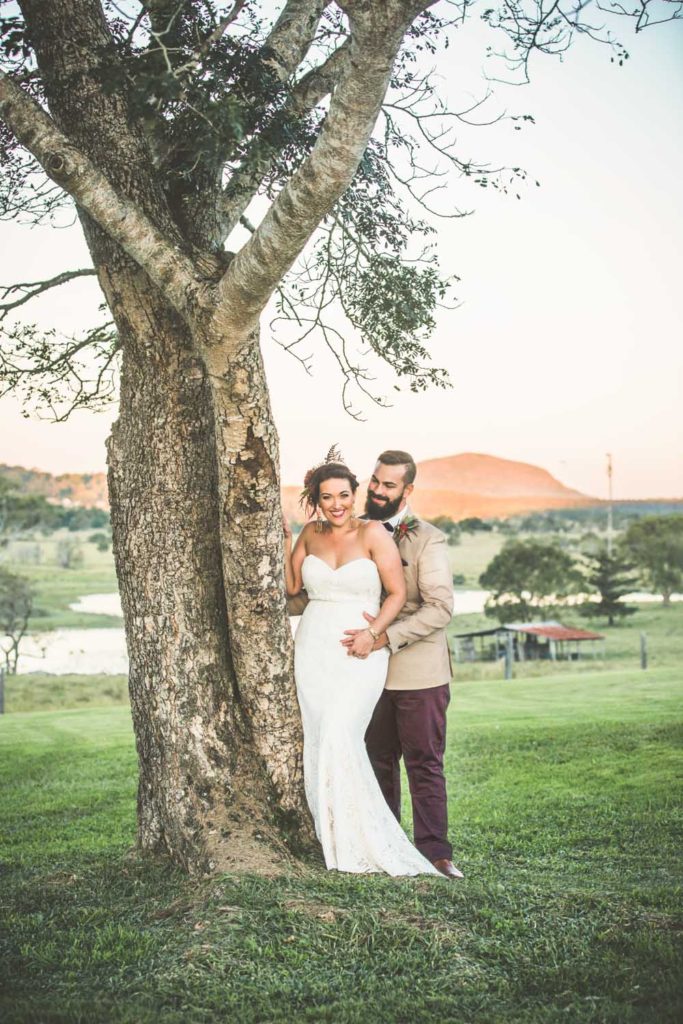 alternative bride and groom in countryside