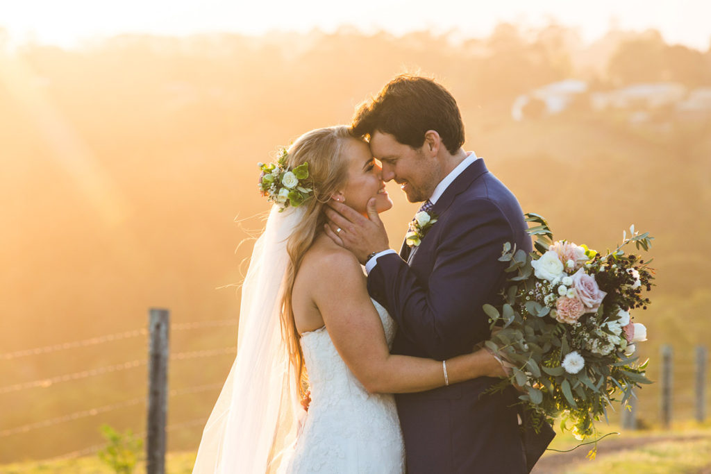 bridal couple in sunshine coast hinterland sunset