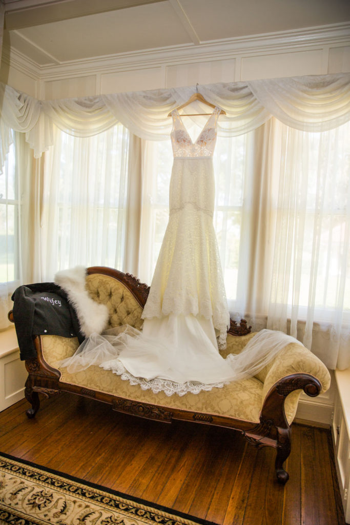 bridal preparation with lace wedding dress