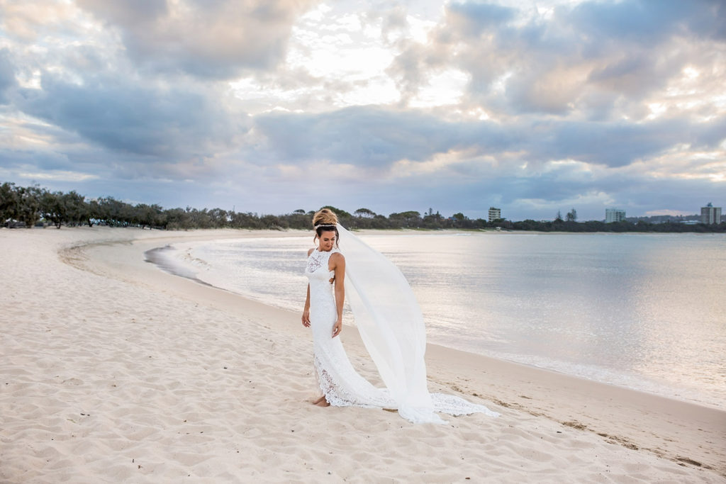 fun groomsmen photo at beach