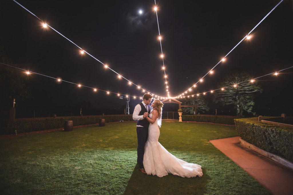 night photograph of bride and groom with festoon lights sunshine coast hinterland