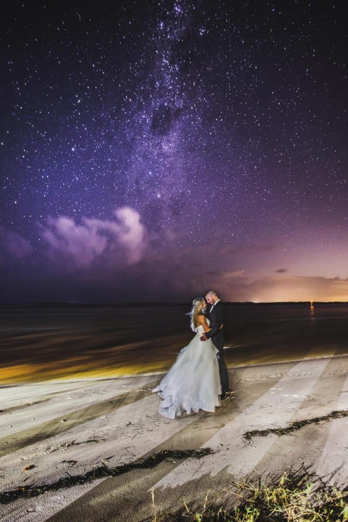night photograph of wedding couple with evening stars