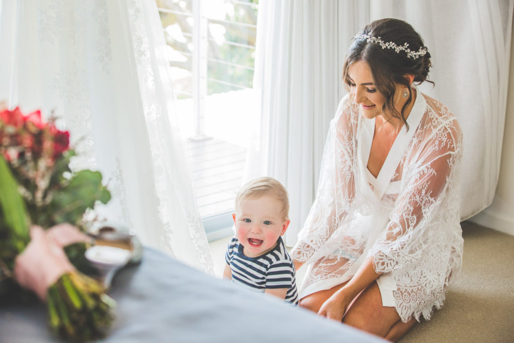 photo of beautiful relaxed bride before wedding with baby