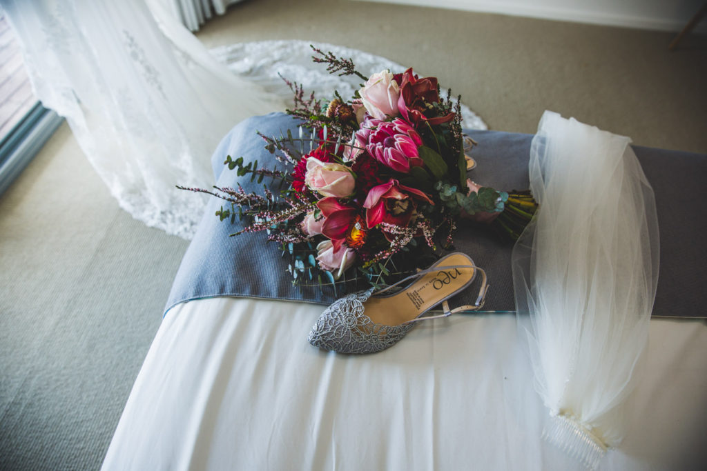 photo of bridal accessories shoes bouquet