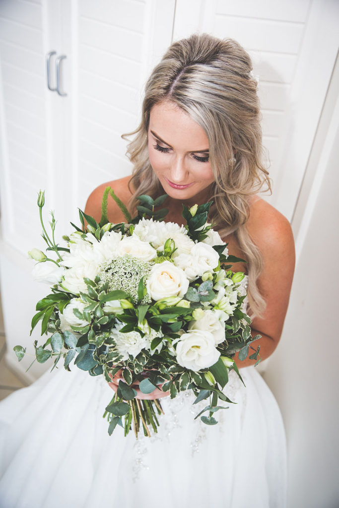 photo of bride with white flowers