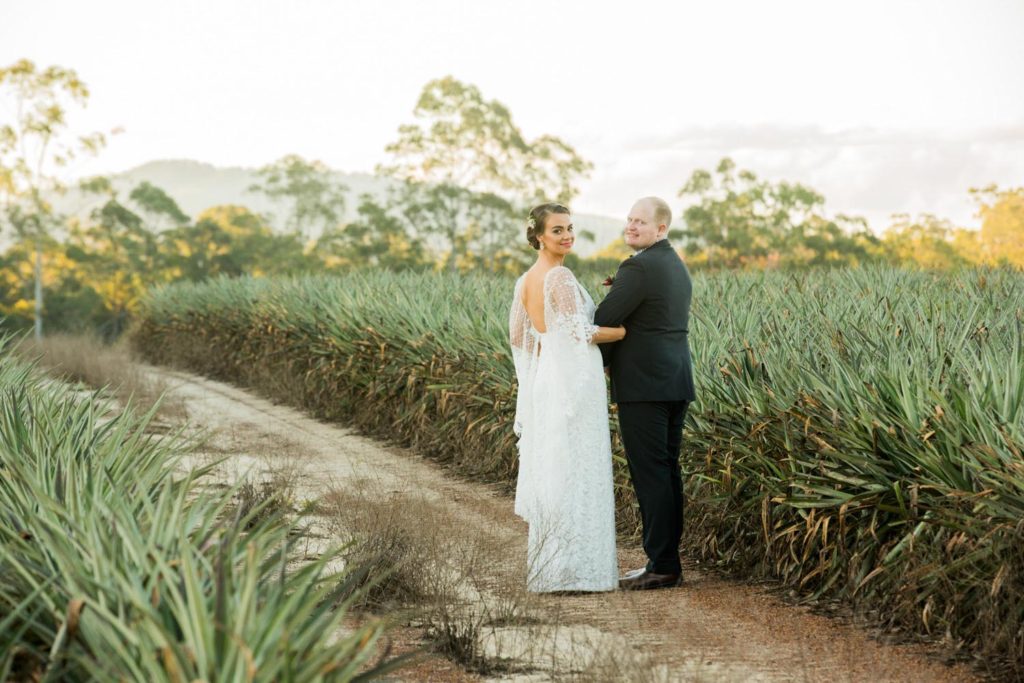 photograph of bride and groom with glasshouse mountains