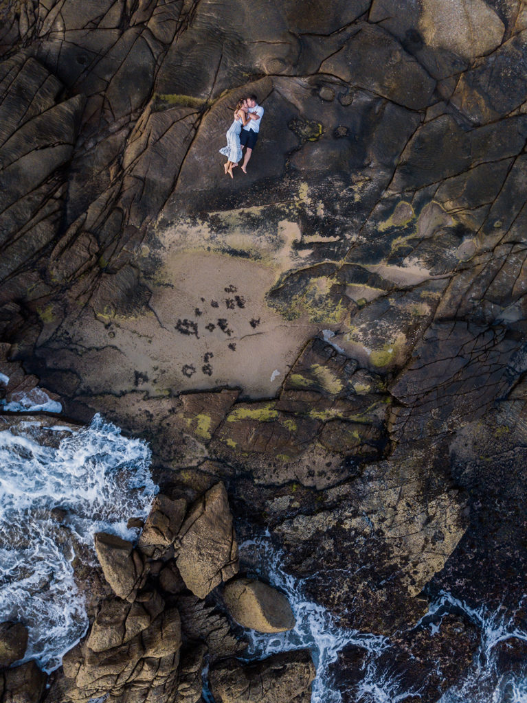 interesting drone photograph of engage couple